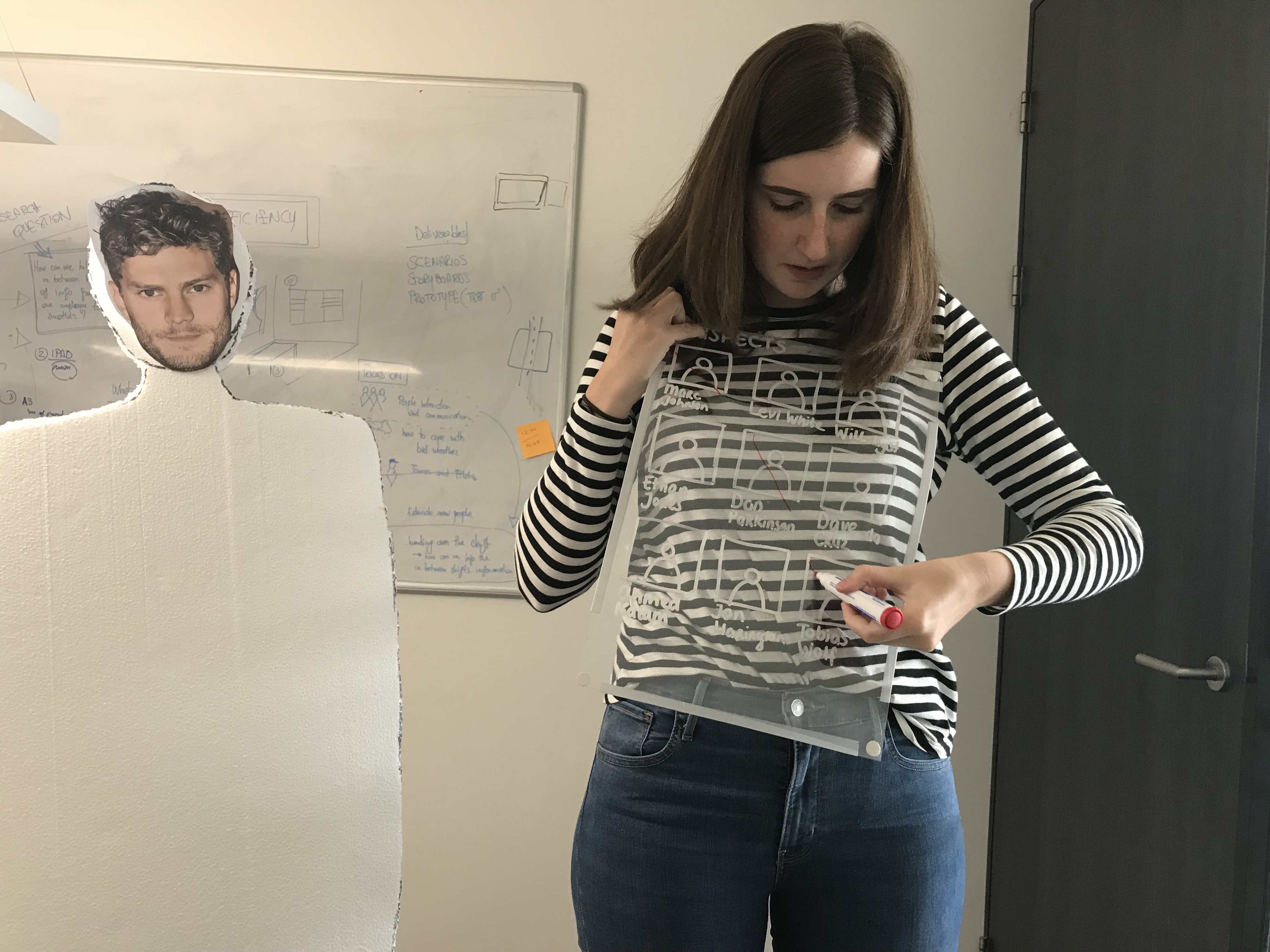 Photo of me showing interaction on the plastic screens with a whiteboard marker